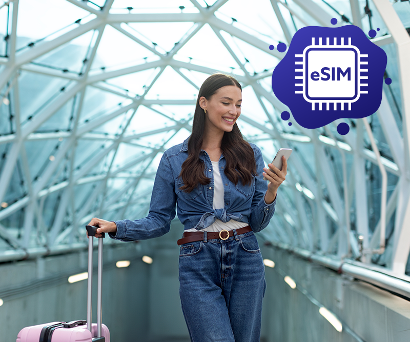 A travelling girl looking at her phone with eSIM Australia plans.