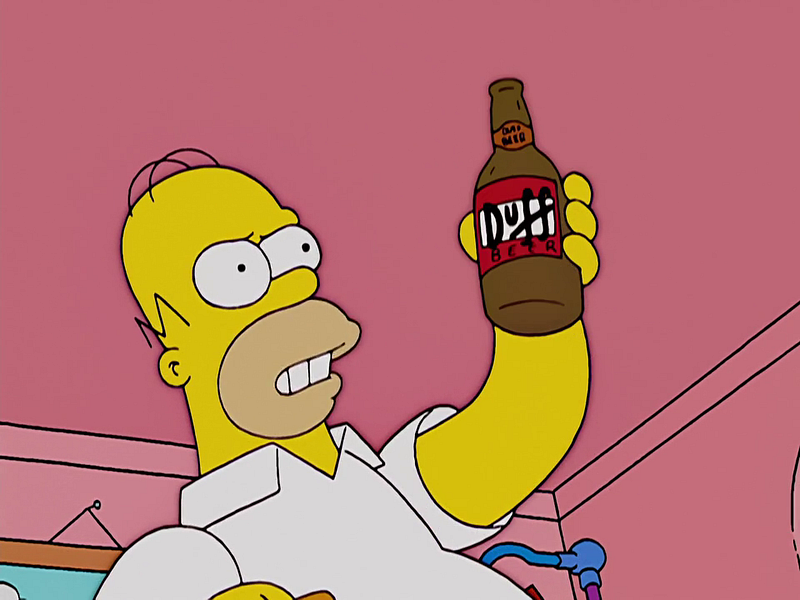 "Homer Simpson holding a beer while saying "Expand my brain, learning juice!"
