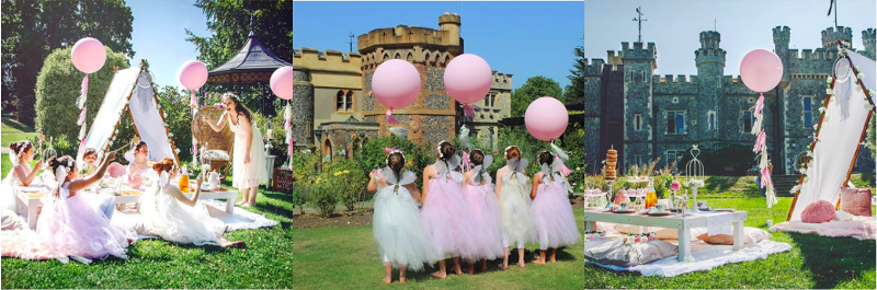 Three pictures of girls at a fairy-themed birthday party. Left: Girls dressed as fairies having a picnic and waving their wands. Centre: girls dressed as fairies holding giant pink balloons, looking at a castle. Right: image of birthday party set up. There’s a picnic mat on the grass, a table on top of the picnic mat and a tipi to the right of the image, with the castle in the background and a balloon floating in between the tipi and the picnic.