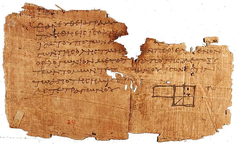 a tattered fragment of papyrus with ptolemaic egyptian scrypt and a geometric diagram