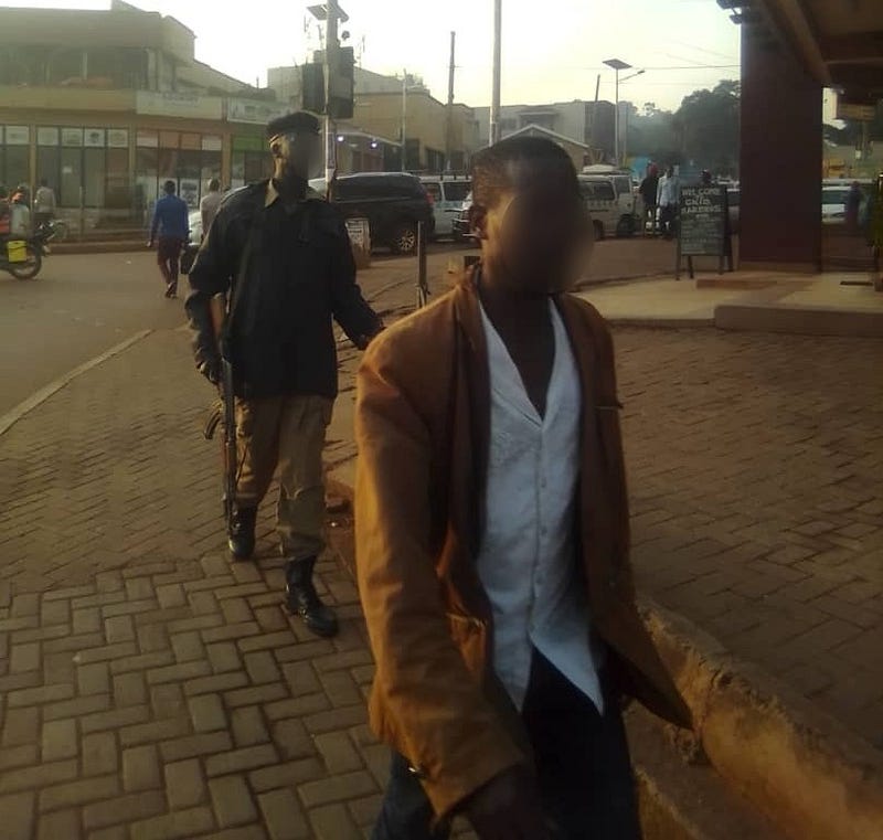 Another extortionist civilian working with the police. Credit: Kalungi James.