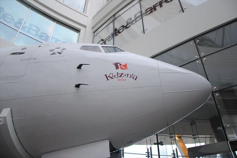 An airplane fuselage guards the entrance to KidZania Istanbul