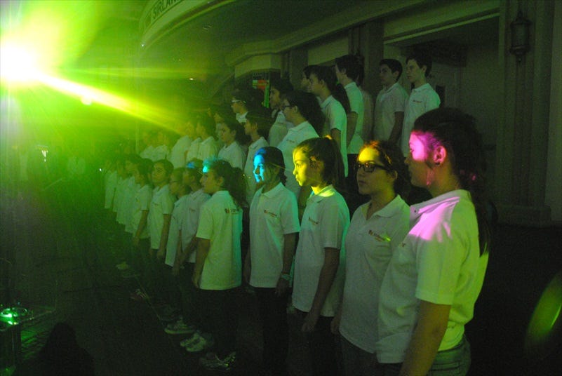 A choir of children singing the Spirit of a Nation, KidZania's National Anthem