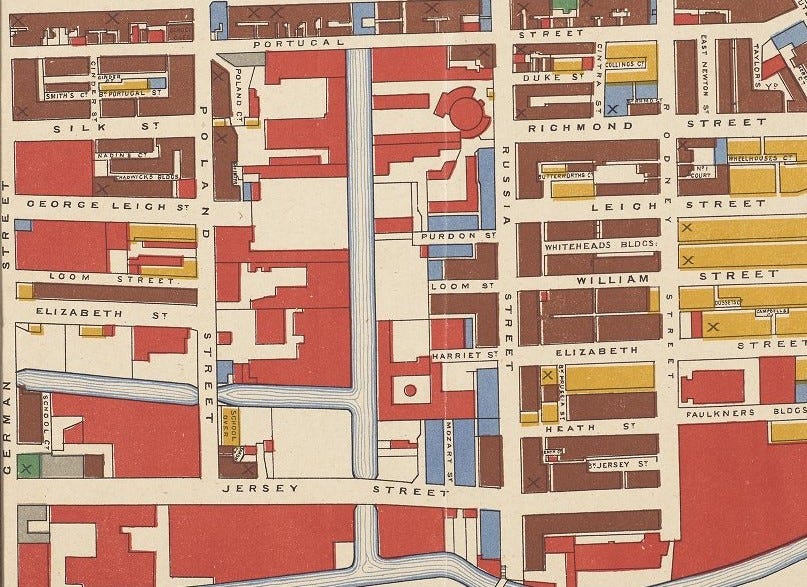 Section of a map of Manchester showing blocks of housing in different colours. The colours represent the age of housing.