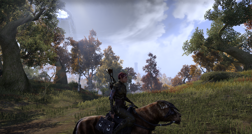 A screenshot from The Elder Scrolls Online taken on the plains of Cyrodiil. In the foreground, a wood elf in green armor sits atop a brown striped cat mount. In the background, a dark anchor is visible above the trees, darkening the blue sky around it.