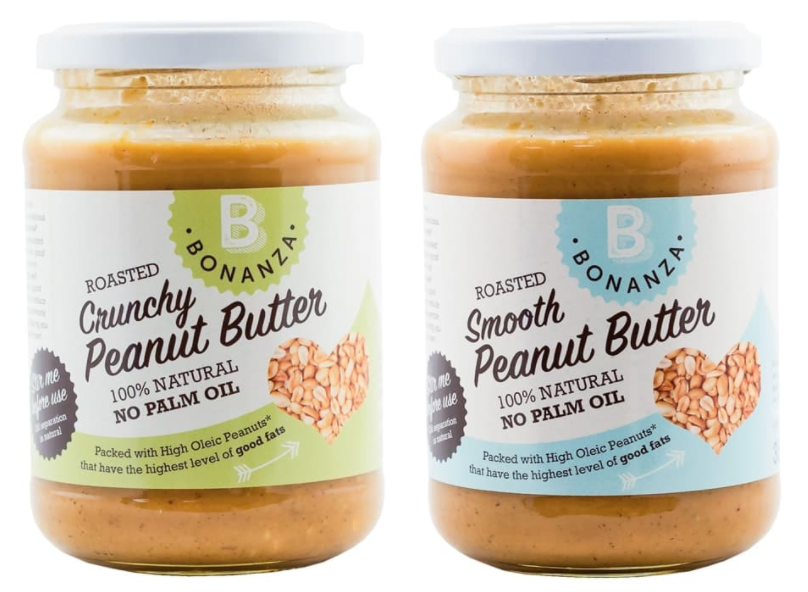 Two jars of no palm oil peanut butter in front of a white background