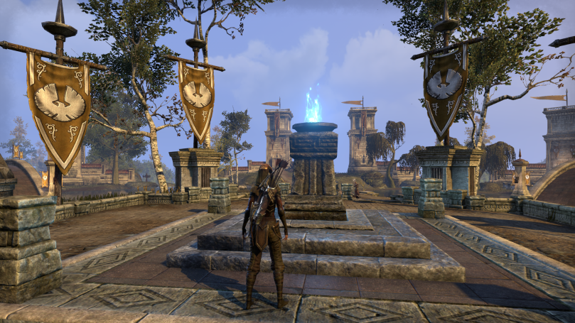 The Aldmeri Dominion base camp in Cyrodiil. Yellow flags with white birds surround a pavilion. In the center is a stone column with a blue flame lit in a brazier at the top.