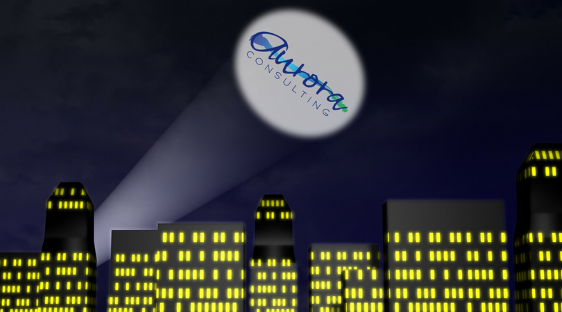 cartoon skyline with building windows lit up and a spotlight with aurora consulting logo where batman signal would be.