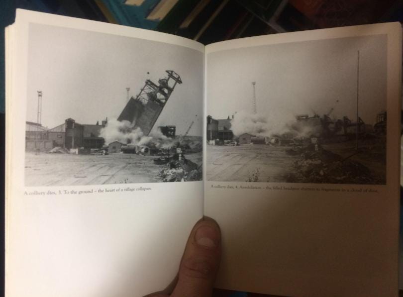 A library book held open showing two photos of the demolition of Shirebrook’s coal mine