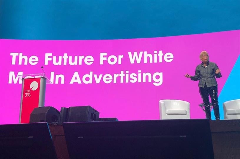 Cindy Gallop standing on stage, text behind her reading “The Future for White Men in Advertising.”