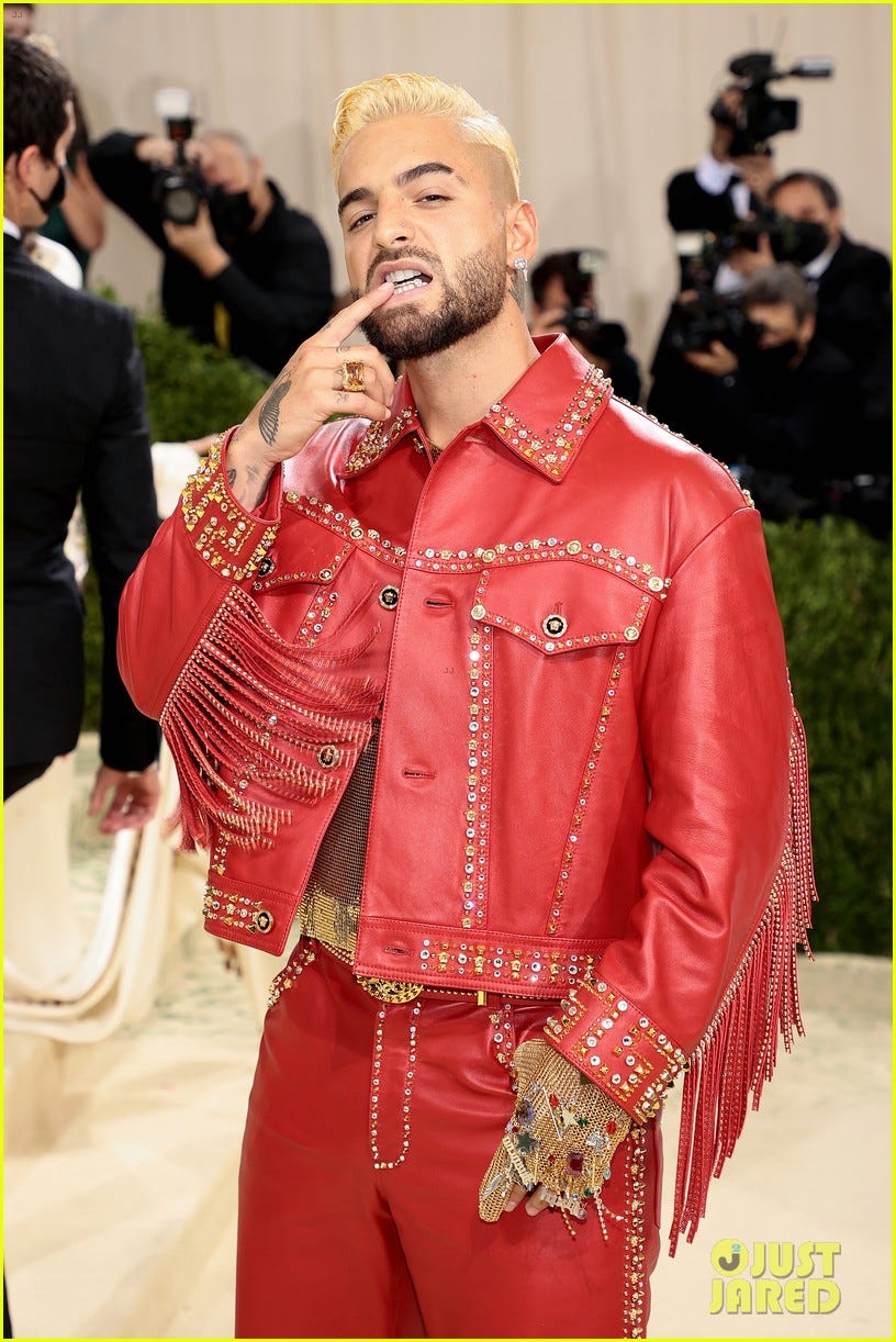 Maluma in red leather at the entrance of the Met.