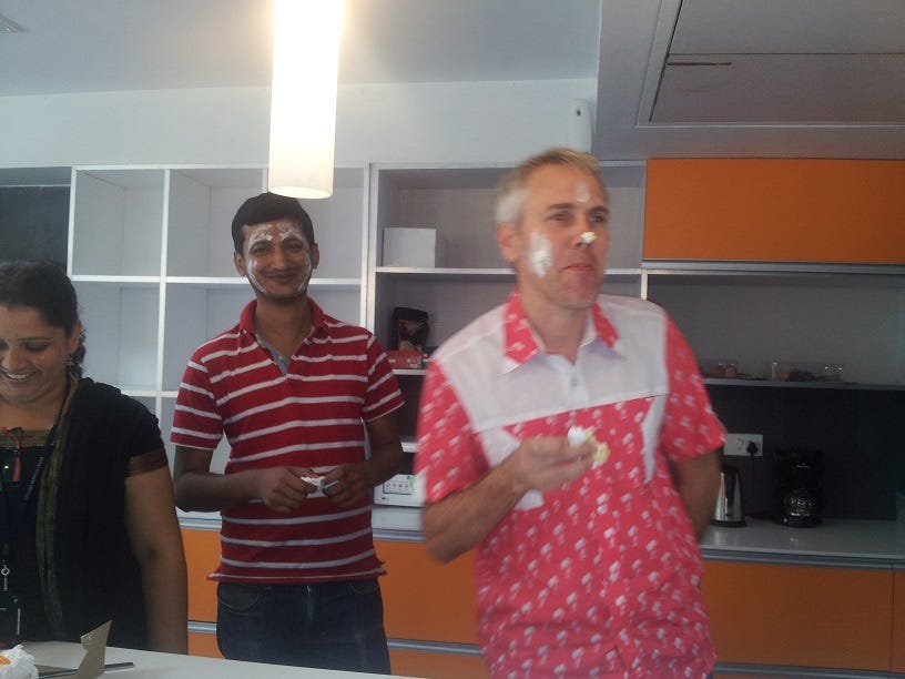 Image of me with Cake on my face for my birthday, a local office tradition