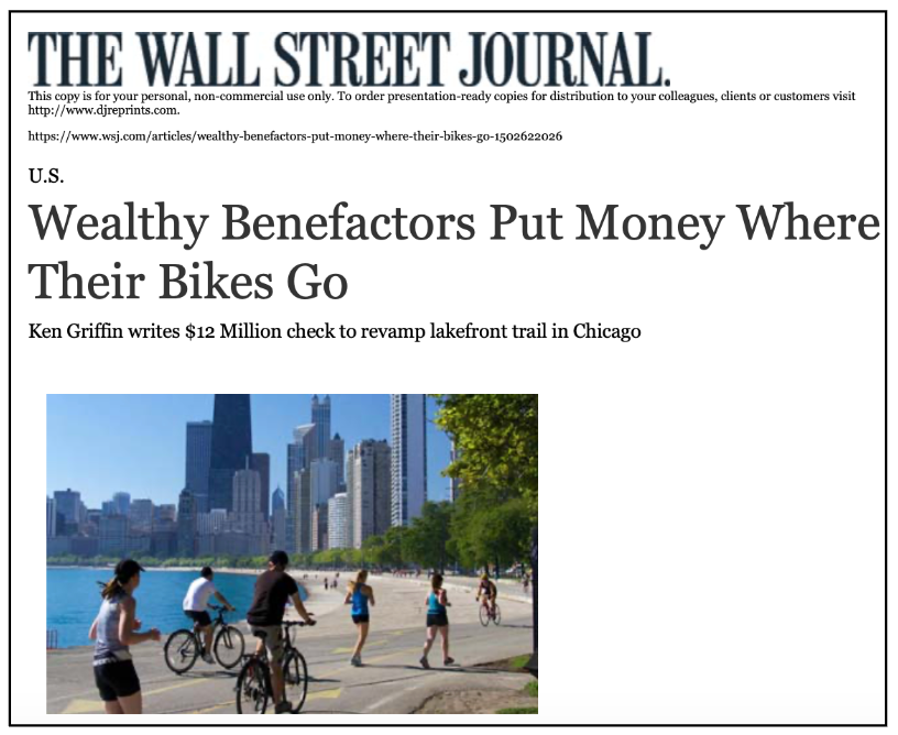 Screenshot of an article that appeared in The Wall Street Journal. Headline reads: Wealthy Benefactors Put Money Where Their Bikes Go. Subheading reads: Ken Griffin writes $12 Million check to revamp lakefront trail in Chicago. Photo below subheadline of cyclists and runners on the Lakefront path with a background of the lake and city skyline.