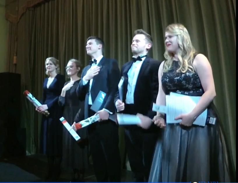 Guildhall singers & pianists standing on stage following the performance