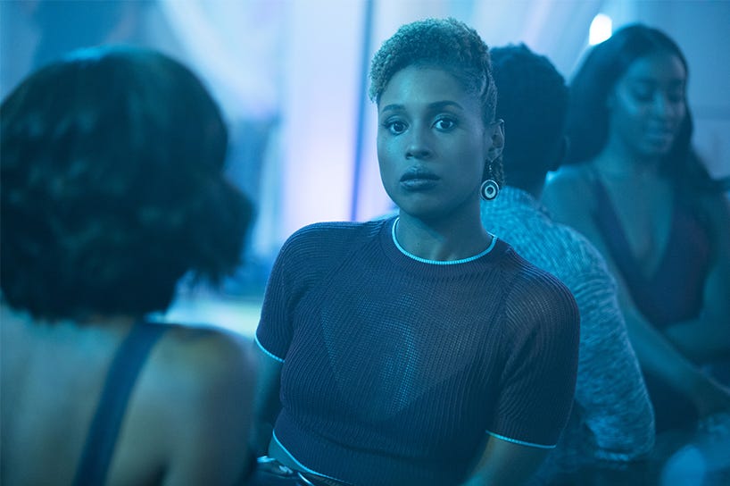 tv still of Issa Rae in Insecure, blue lighting.