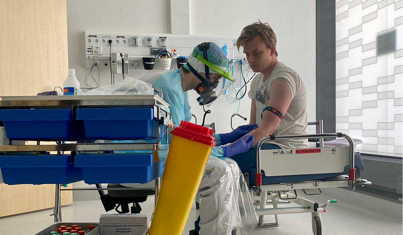 Patient sitting for tests during clinical trial.