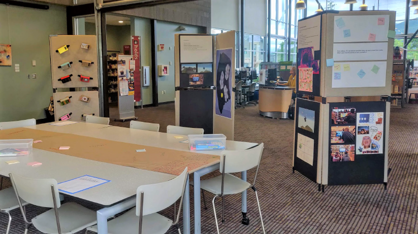 Photo: A view of the exhibit, “Here but Not Here” which includes artifacts such as collages expressing how students felt in VR. 
 
 Credit: Patiño-Liu