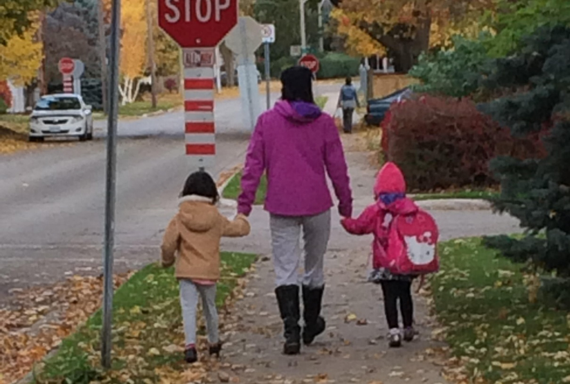 Mom and kids walking to school