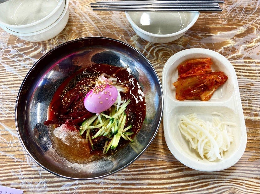 My traditional Korean food on the island! There’s a boiled egg on top of my cold noodles that is also purple!