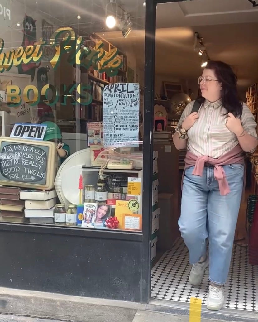 a photo of Bella leaving a used bookstore