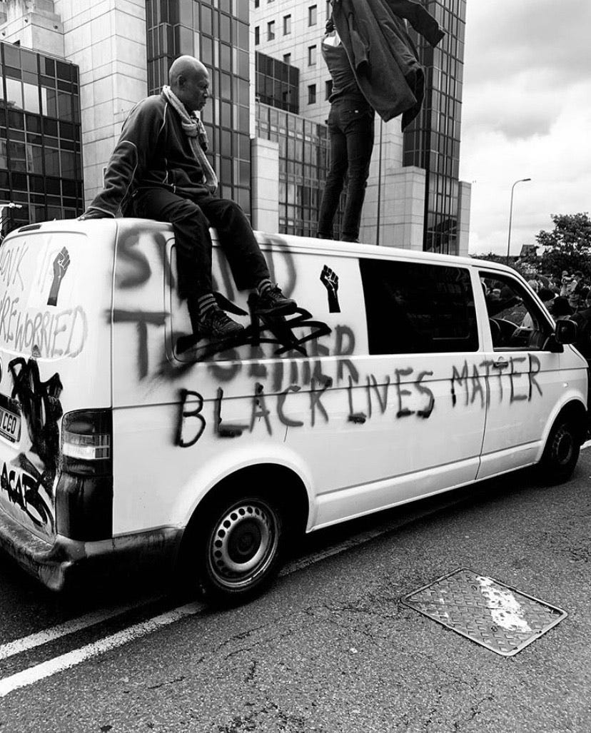 Protestors on top of a van sprayed with the words ‘Black Lives Matter’ London march, London June 2020