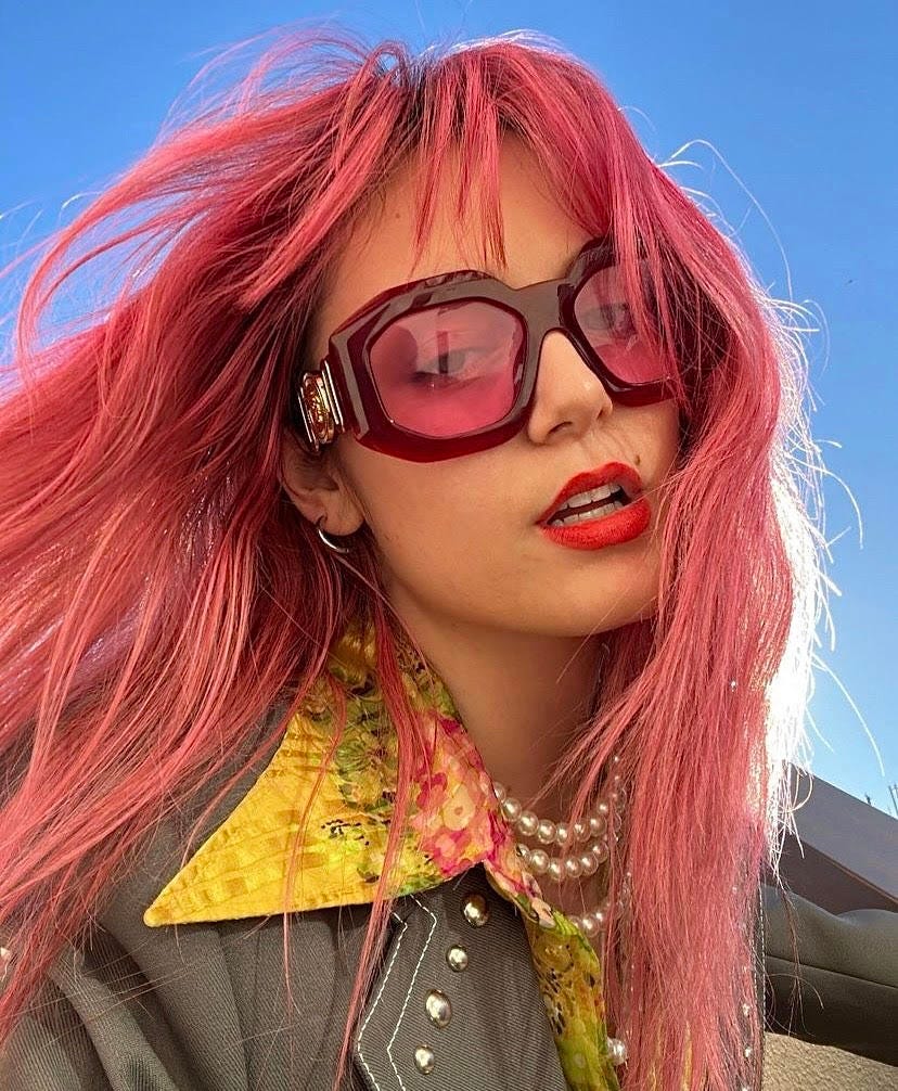 Florence Given selfie with pink hair pink sunglasses and red lipstick