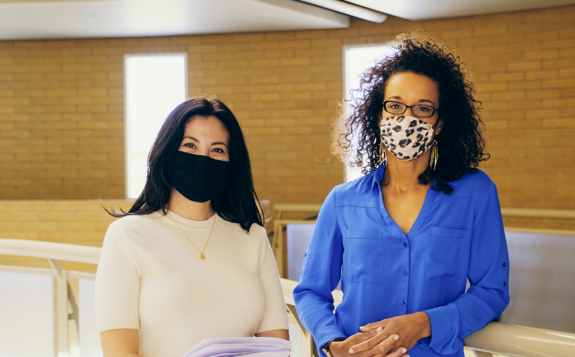 Educators wearing masks look at camera