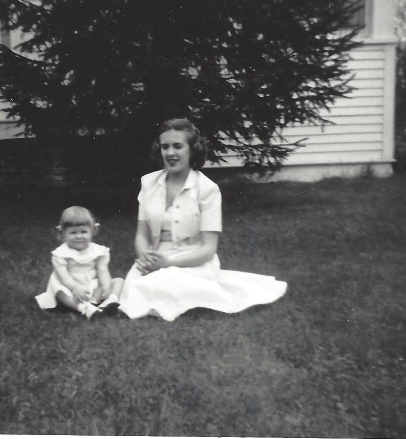Laurie and Mom sitting on Grandma’s lawn