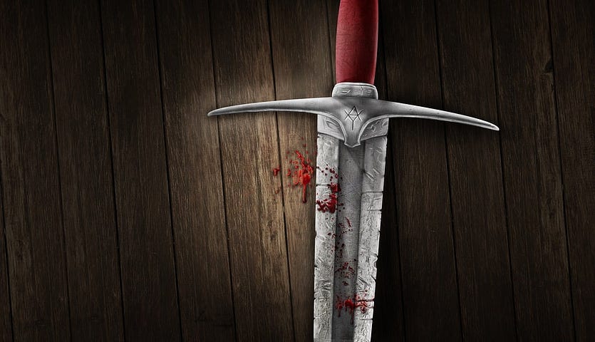 sword on a table with blood