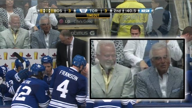 Two Tan Guys Behind Toronto Maple Leafs