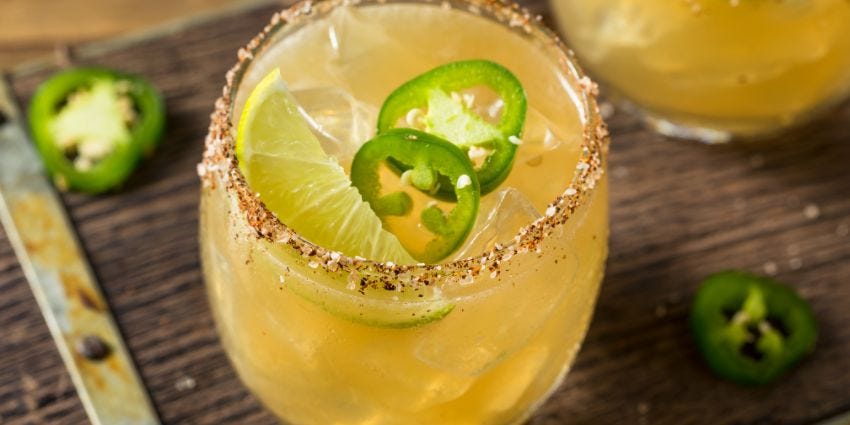 A mixed drink with a salt rim on the glass.