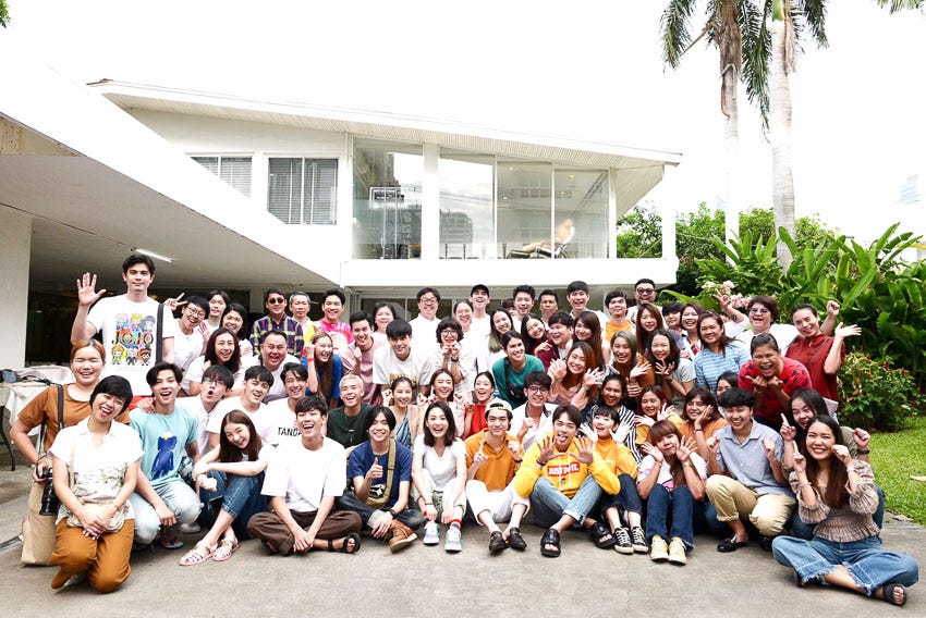 The Nadao Bangkok family photo in the company’s front yard