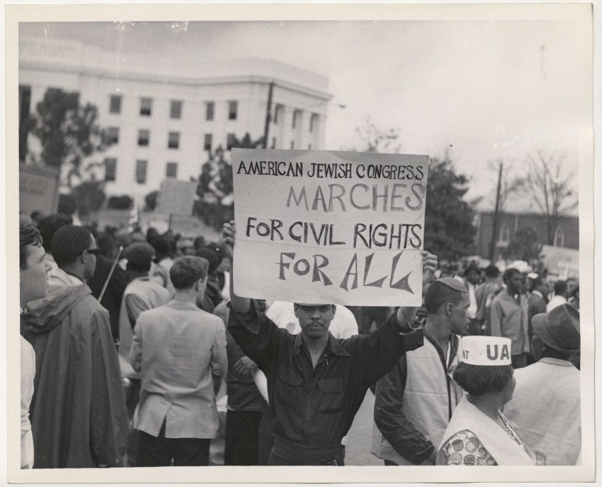 Demonstrator holding American Jewish Congress sign at Montgomery March. Original photograph found in Box 744, Folder 41 of the American Jewish Congress records. Image courtesy of AJHS.