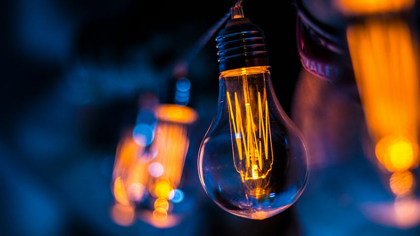 a lightbulb close up shot on a dark blue background
