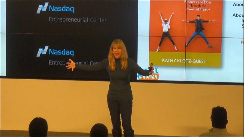 Woman giving a speech on stage.