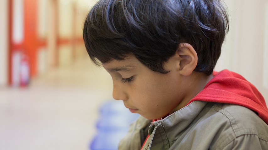 Small boy staring down and waiting — “I Wish I Were Thor” by “Arthur G. Hernandez”