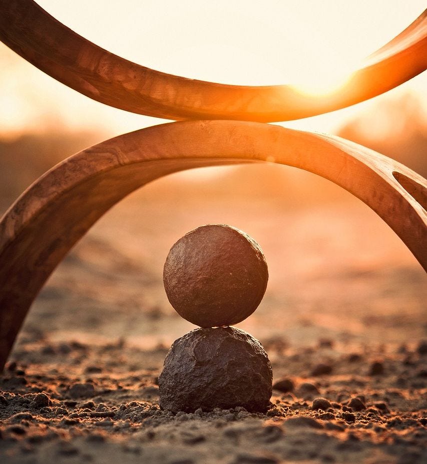 A balanced ball lying on sand