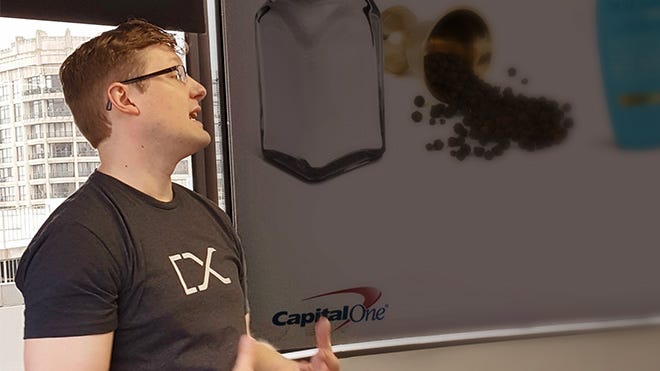 Man in a DevExchange shirt giving a presentation.