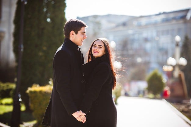 beautiful-young-couple-meets-city-park