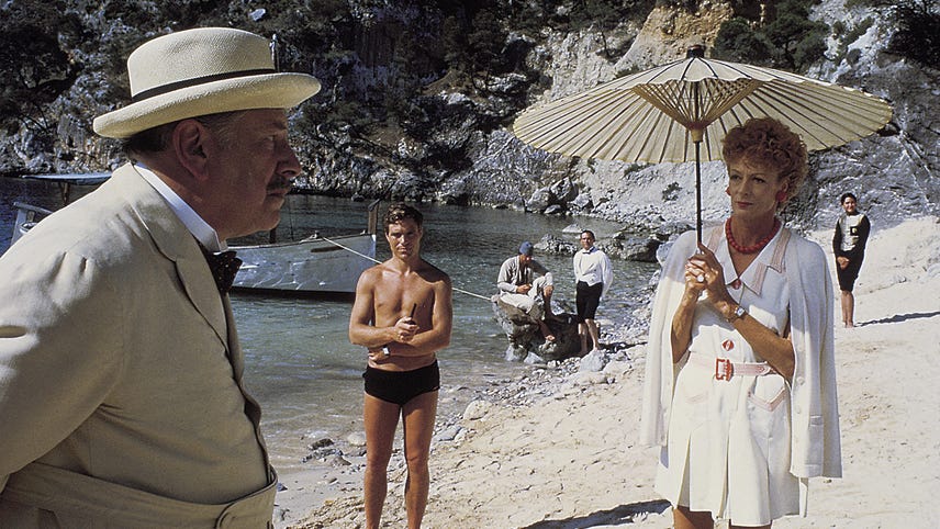 Dame Maggie Smith and Peter Ustinov on the beach in “Evil Under the Sun.”