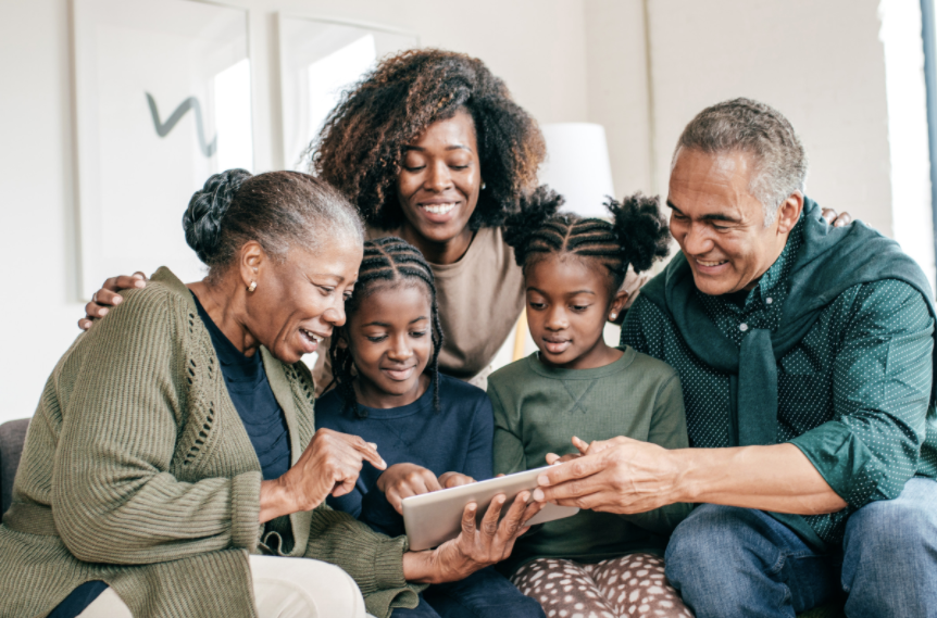 Family reading together on Simbi