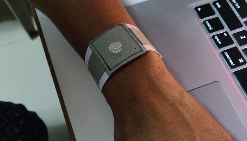 A paper prototype of the dynaband that looks like a wrist watch