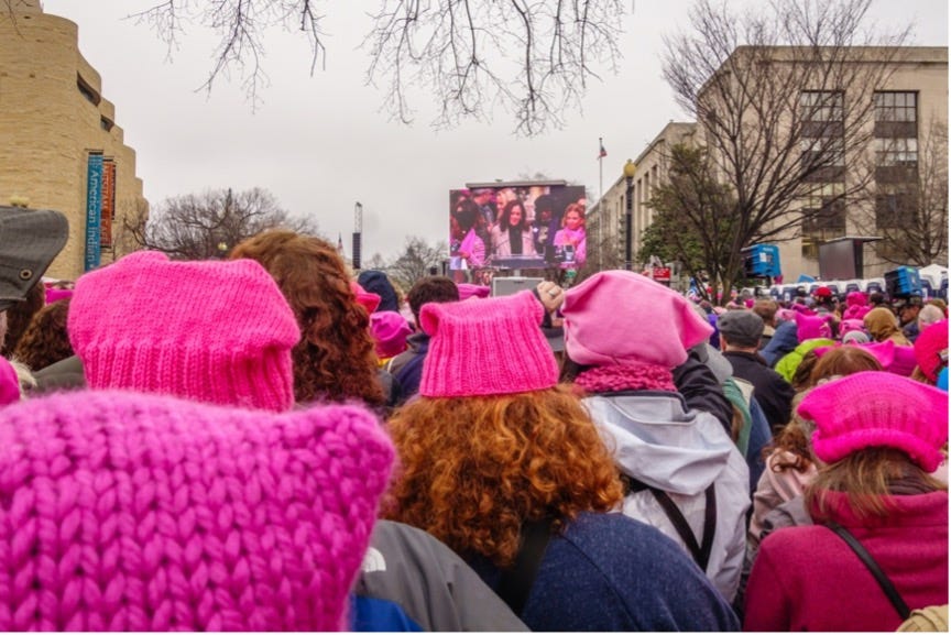 Protesters wearing pink knitted “pussy hats” at The Women’s March January 2017