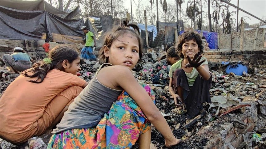 Rohingya children were trying to collect necessary items after a fire gutted over 10,000 tents in March, 2021. Cox’s Bazar Photo: Md. Kamruzzaman — Anadolu Agency