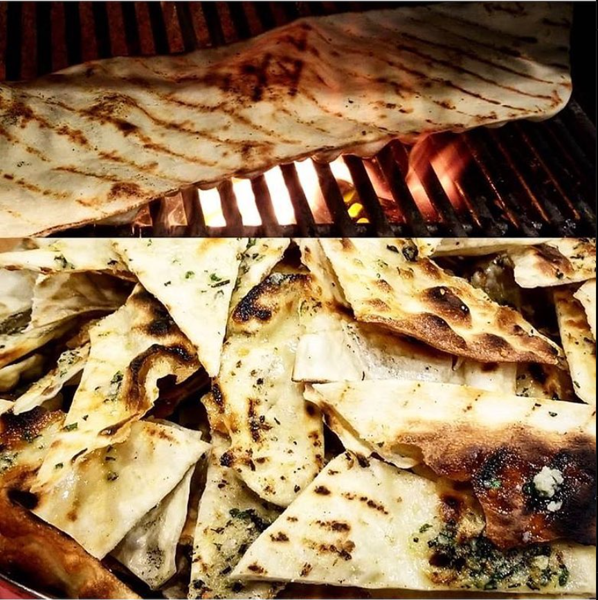 Grilling a flattened piece of dough for a fun addition to our breadbasket — a crisp cracker