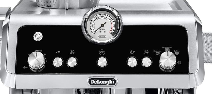 A close up of a DeLonghi Coffee machine highlighting all the dials and buttons this machine has.