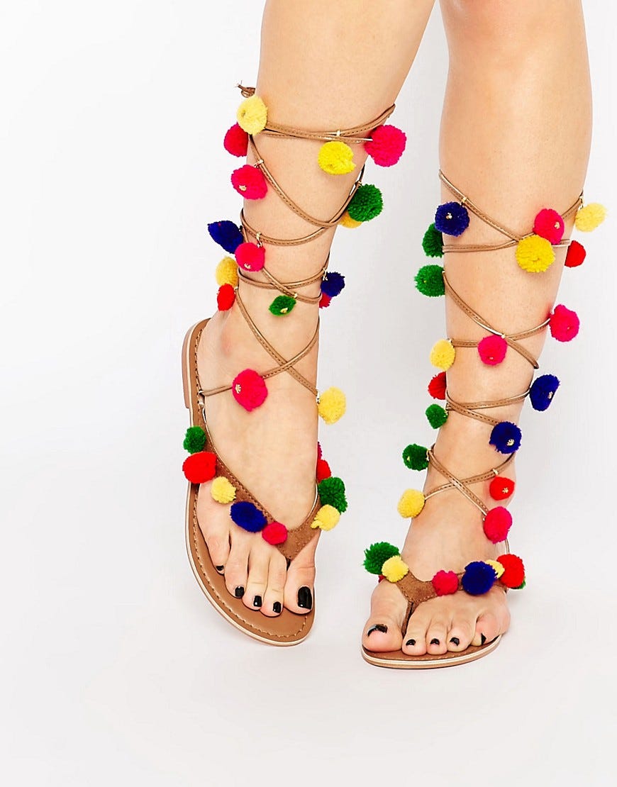 http://www.asos.com/Glamorous/Glamorous-Tan-Tie-Up-Pom-Pom-Flat-Sandals/Prod/pgeproduct.aspx?iid=6244530&cid=17170&sh=0&pge=0&pgesize=204&sort=-1&clr=Tan&totalstyles=450&gridsize=3