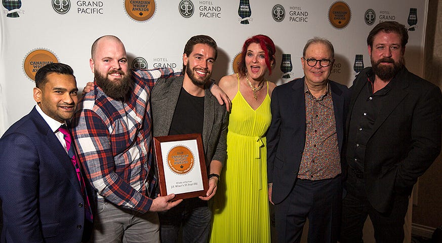 Corby Spirit & Wine executives celebrate with Heather Leary and Davin de Kergommeaux of the Canadian Whisky Awards. Photo ©2018, Mark Gillespie/CaskStrength Media.