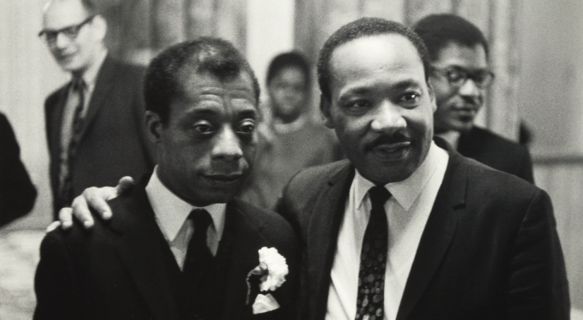 Dr. Martin Luther King Jr. with his arm around James Baldwin.