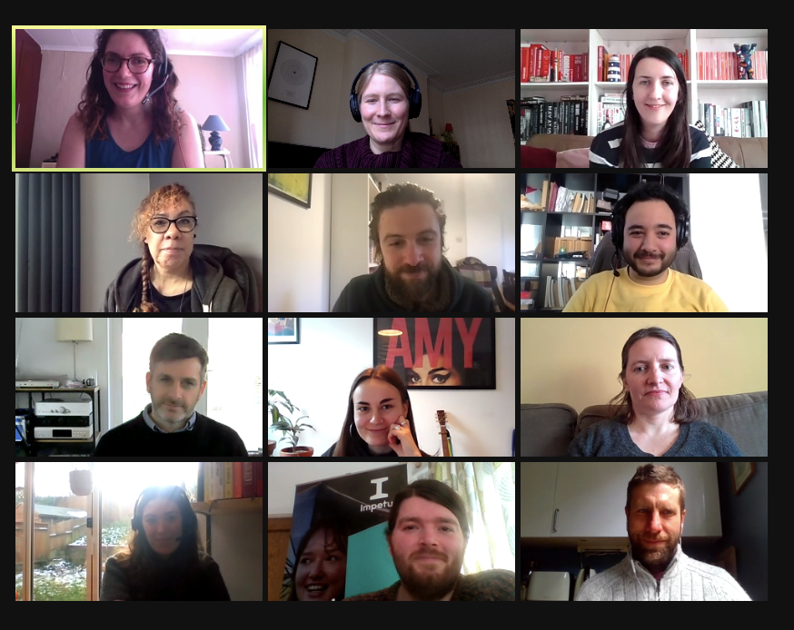 A group of smiling adults on a Zoom call